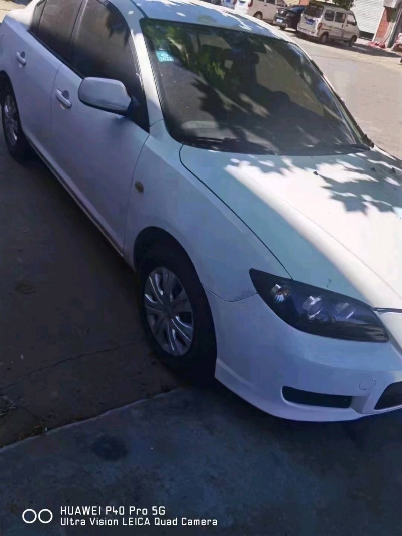 北京12年马自达32